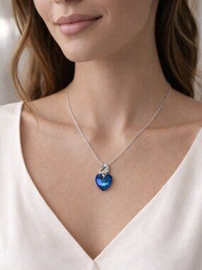 Silver Blue Crystal Heart Necklace with Swan Detail – Elegant Sparkle Pendant